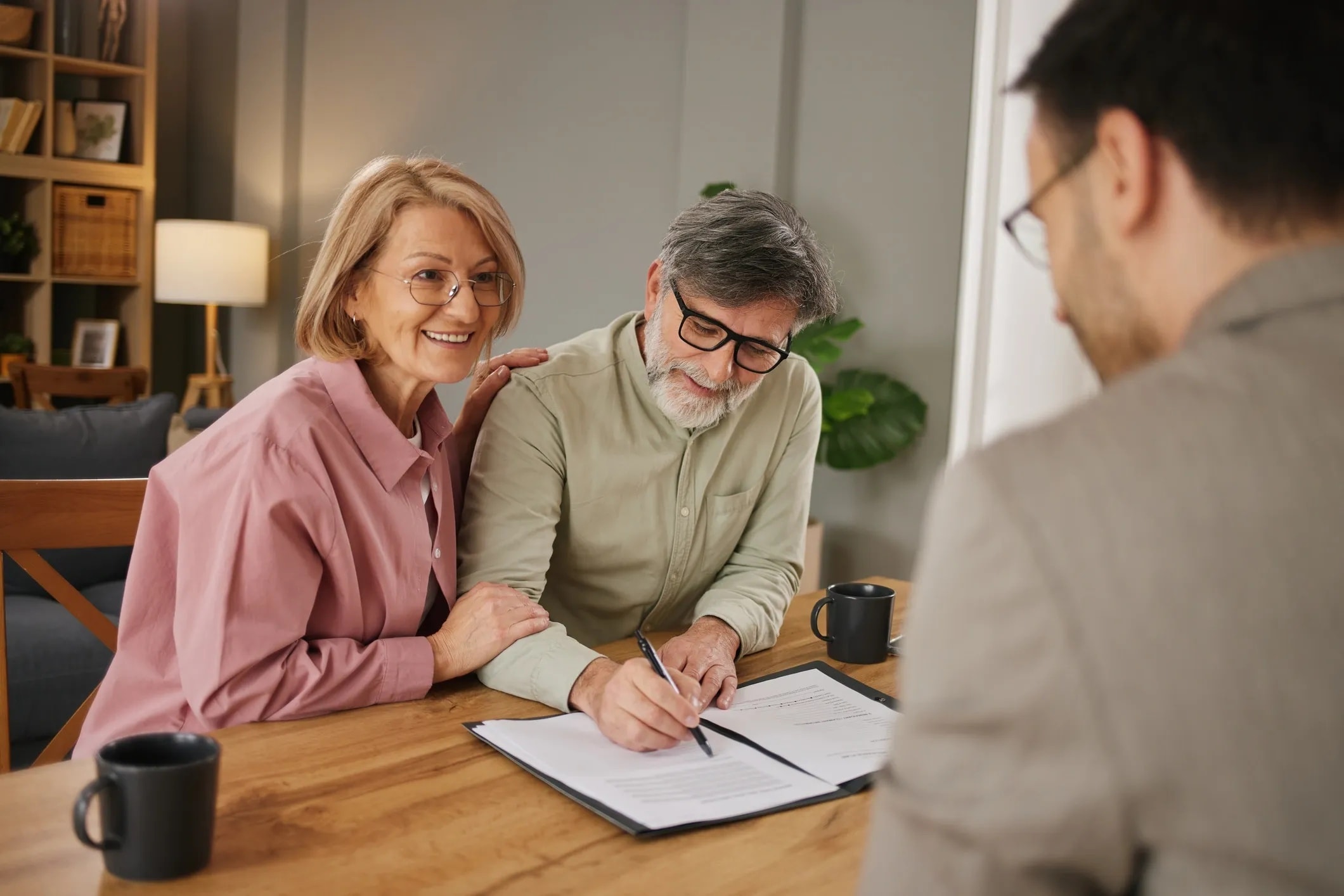 Financial planning advisor reviewing documents with couple